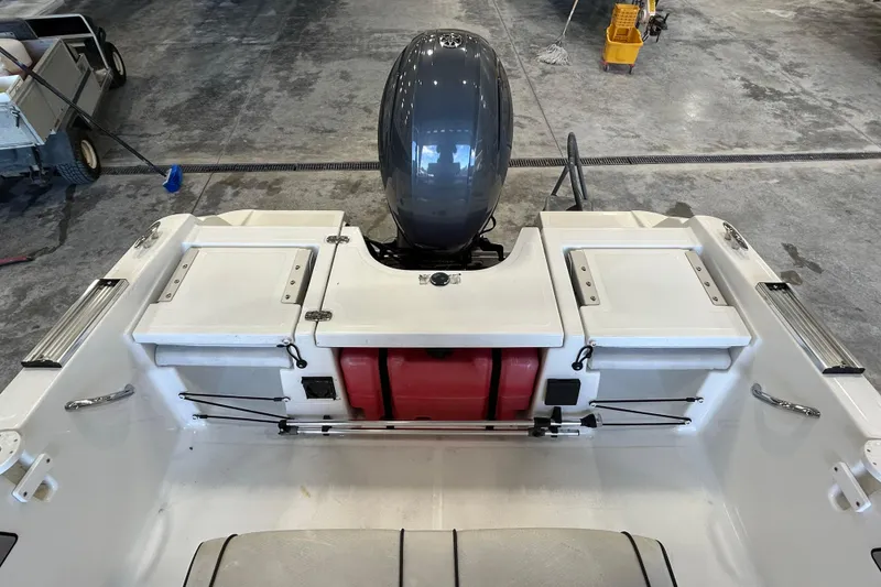 Slide: The Image of 2020 Wellcraft 162 Fisherman boat interior with motor and storage compartments. - 11