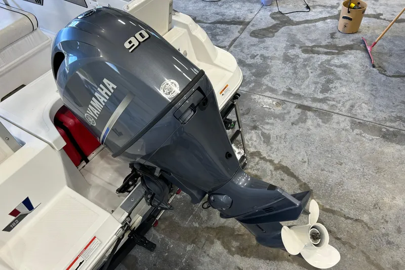 Slide: The Image of 2020 Wellcraft 162 Fisherman with Yamaha 90 outboard motor in a garage setting. - 12