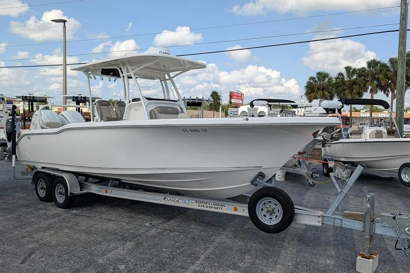 The Image of 2023 Key West 263 FS boat on trailer in outdoor dealership lot. - 0
