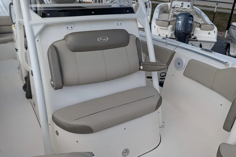 Slide: The Image of 2023 Key West 263 FS boat interior with cushioned seating and modern design. - 16