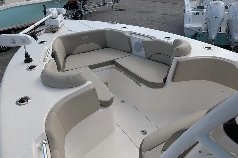 Slide: The Image of 2023 Key West 263 FS boat interior with cushioned seating and modern design. - 17