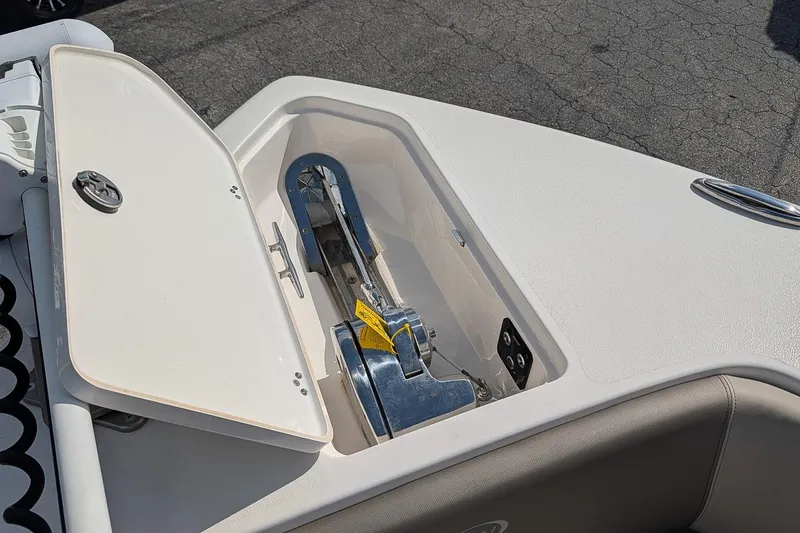 Slide: The Image of Open anchor compartment on 2023 Key West 263 FS boat, showcasing storage and design. - 21