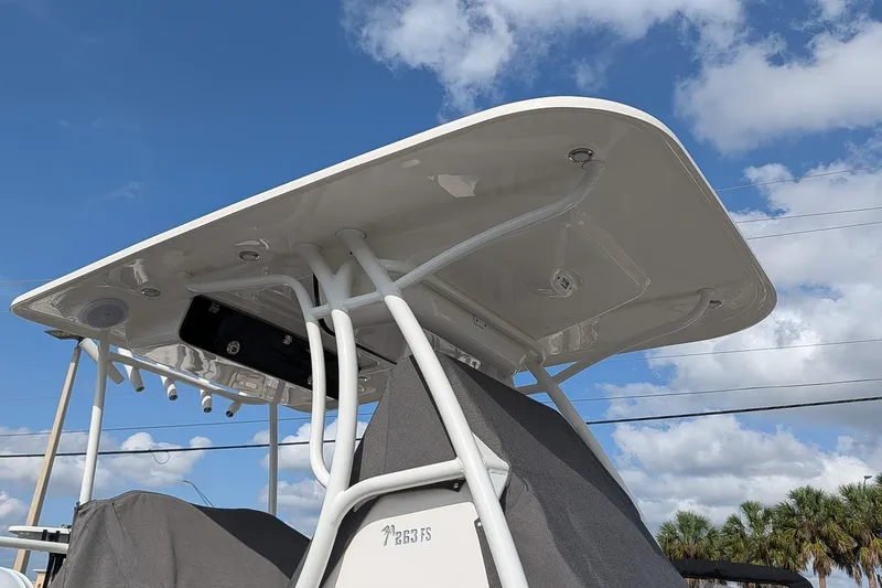 Slide: The Image of 2023 Key West 263 FS boat with T-top against a blue sky background. - 24