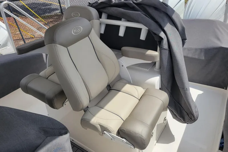 Slide: The Image of 2023 Key West 263 FS boat seat with armrests and protective cover. - 25
