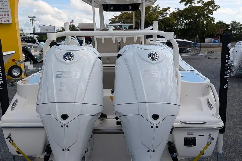 Slide: The Image of 2023 Key West 263 FS boat with twin Yamaha 250 V6 engines displayed outdoors. - 4