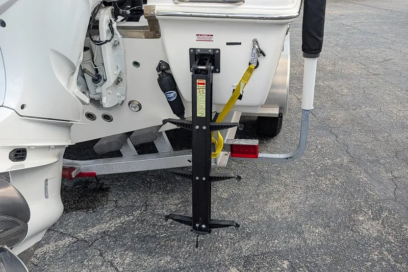Slide: The Image of 2023 Key West 263 FS boat trailer hitch and motor detail. - 5