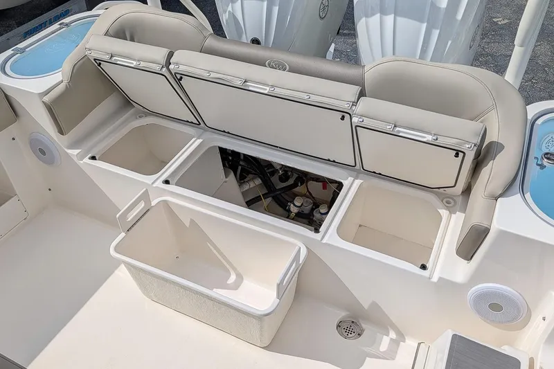 Slide: The Image of 2023 Key West 263 FS boat interior with storage compartments and seating. - 8