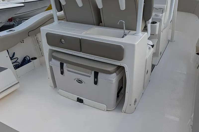 Slide: The Image of 2023 Key West 263 FS boat interior with seating and storage area. - 9