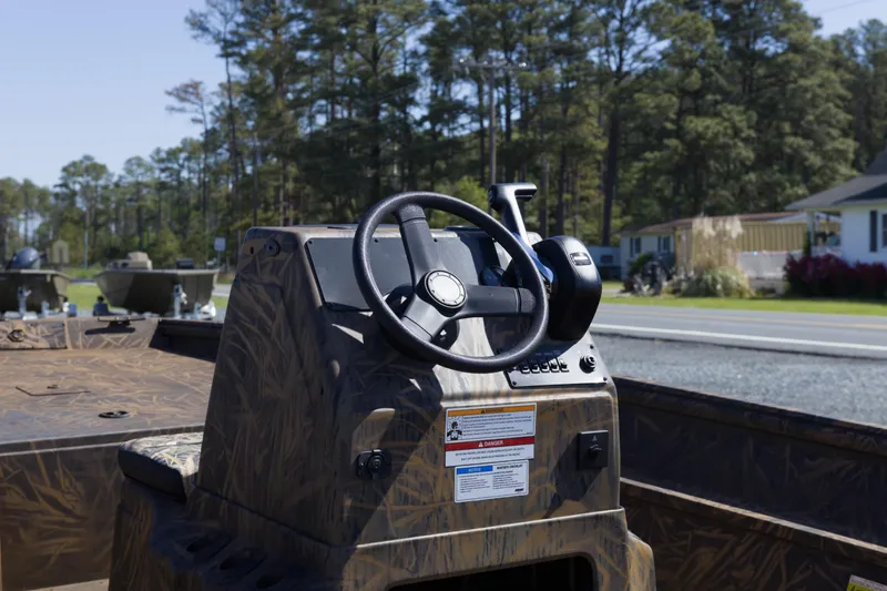 Slide: The Image of 2026 G3 Gator Tough 17 CC boat console with steering wheel, outdoors. - 9