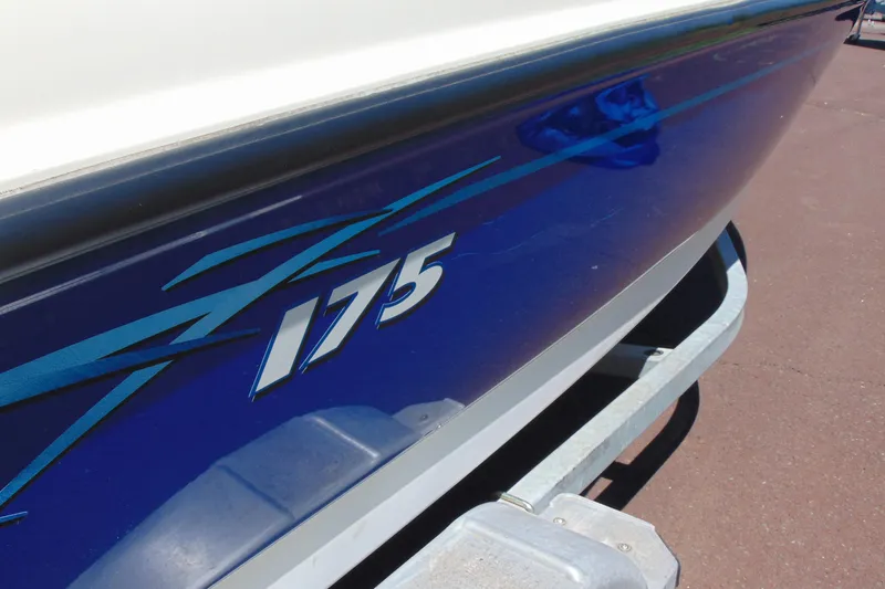 Slide: The Image of 2006 Bayliner 175 Bowrider boat on trailer, close-up of blue hull design. - 13