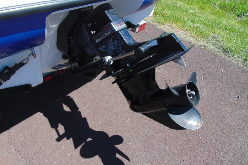 Slide: The Image of 2006 Bayliner 175 Bowrider boat with MerCruiser outboard motor on pavement. - 5