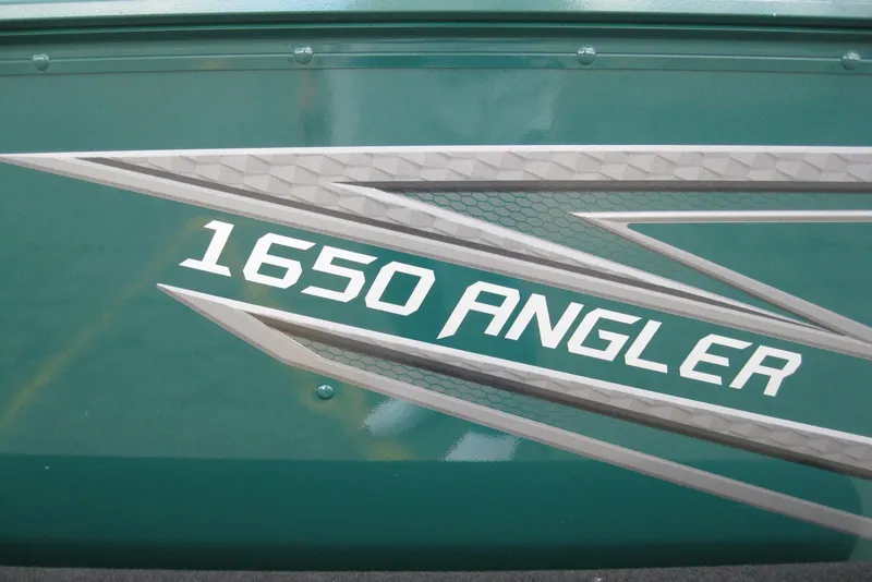 Slide: The Image of 2026 Lund 1650 Angler SS boat logo on green background. - 4