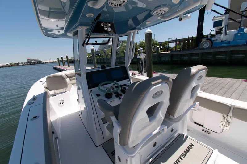 Slide: The Image of 2023 Sportsman Heritage 261 Center Console boat interior at dock. - 13