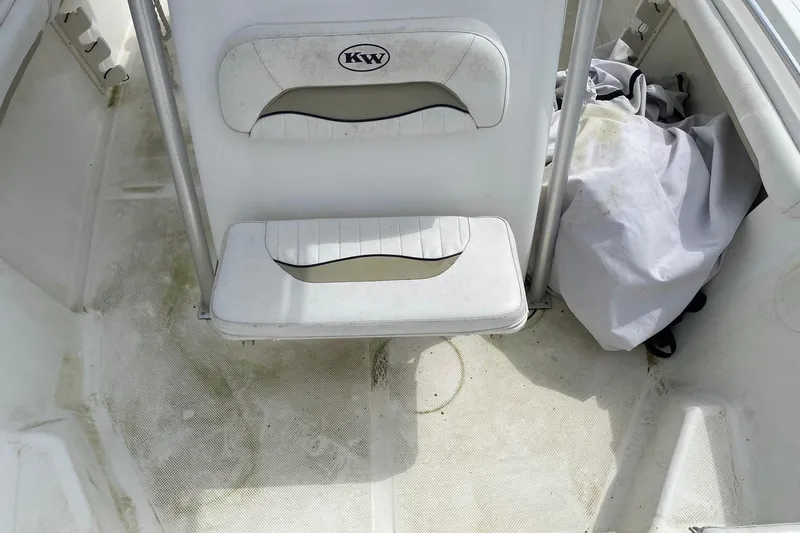 Slide: The Image of 2010 Key West 211 Center Console boat interior with seating and storage area. - 10