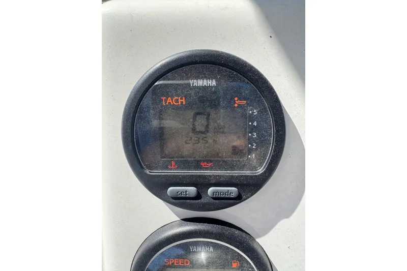 Slide: The Image of Yamaha tachometer on 2010 Key West 211 Center Console boat dashboard. - 14