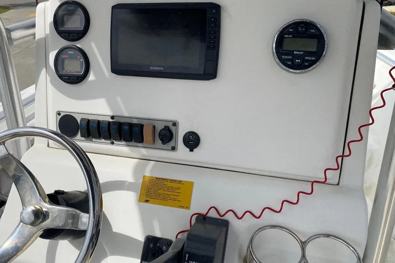 Slide: The Image of 2010 Key West 211 Center Console dashboard with Garmin display and control panel. - 8