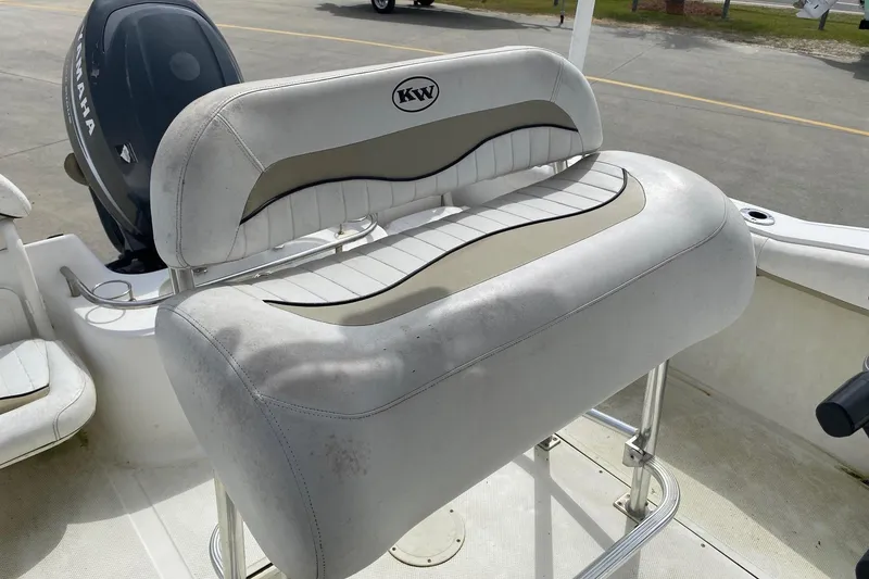 Slide: The Image of 2010 Key West 211 Center Console boat with Yamaha engine and cushioned seating. - 9