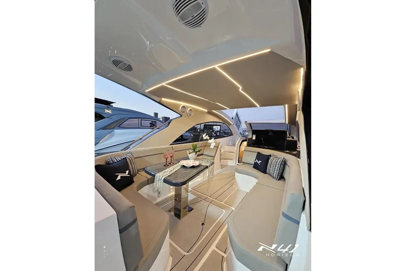 Slide: The Image of Luxurious interior of 2026 NX Boats NX41 HORIZON with elegant seating and ambient lighting. - 20