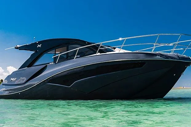 Slide: The Image of 2026 NX Boats NX41 HORIZON luxury yacht on clear turquoise water under blue sky. - 33