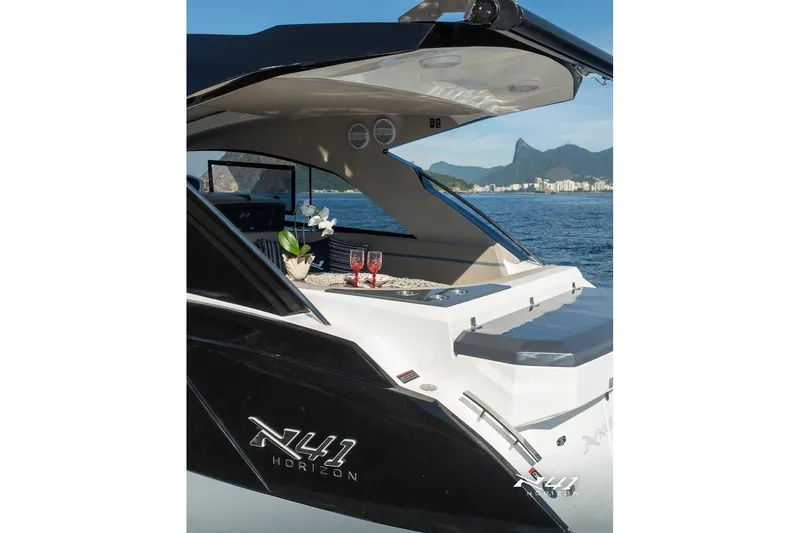 Slide: The Image of Luxury 2026 NX Boats NX41 HORIZON yacht with elegant interior, docked by scenic coastline. - 38