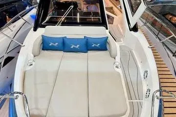 Slide: The Image of 2026 NX Boats NX41 HORIZON luxury deck with cushioned seating and blue pillows. - 4