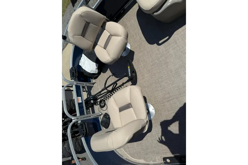 Slide: The Image of 2023 Sun Tracker Bass Buggy 16 XL Select interior with beige seating and trolling motor. - 11
