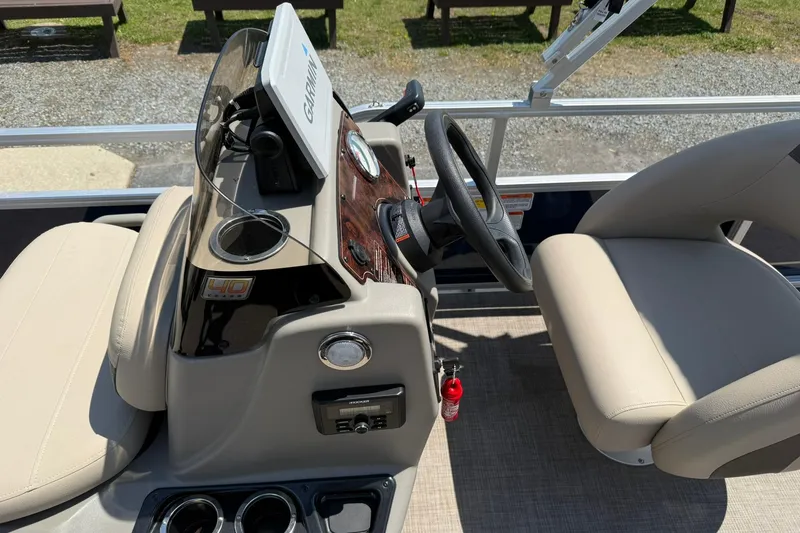 Slide: The Image of 2023 Sun Tracker Bass Buggy 16 XL Select boat interior with steering console and seating. - 13