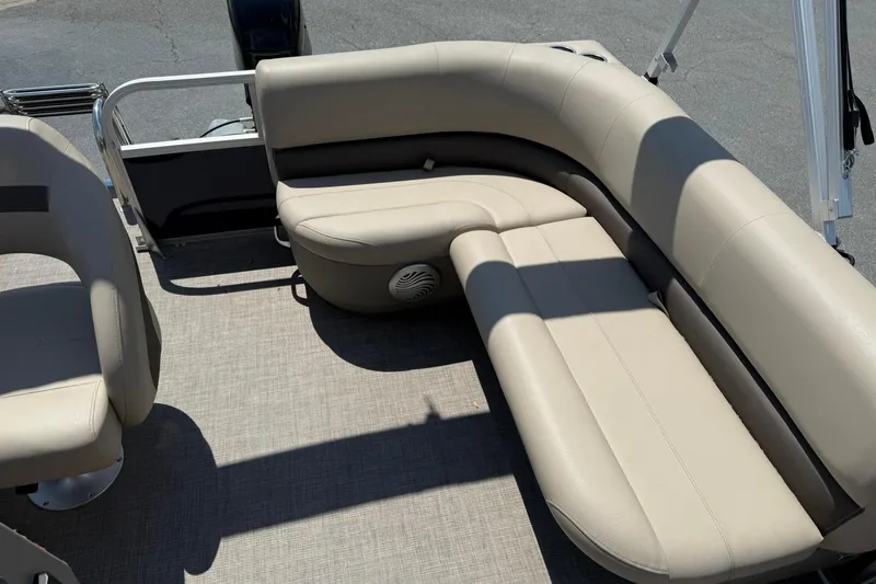 Slide: The Image of 2023 Sun Tracker Bass Buggy 16 XL Select pontoon boat with beige seating. - 16