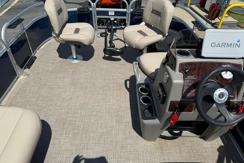 Slide: The Image of 2023 Sun Tracker Bass Buggy 16 XL Select interior with Garmin system and seating. - 18
