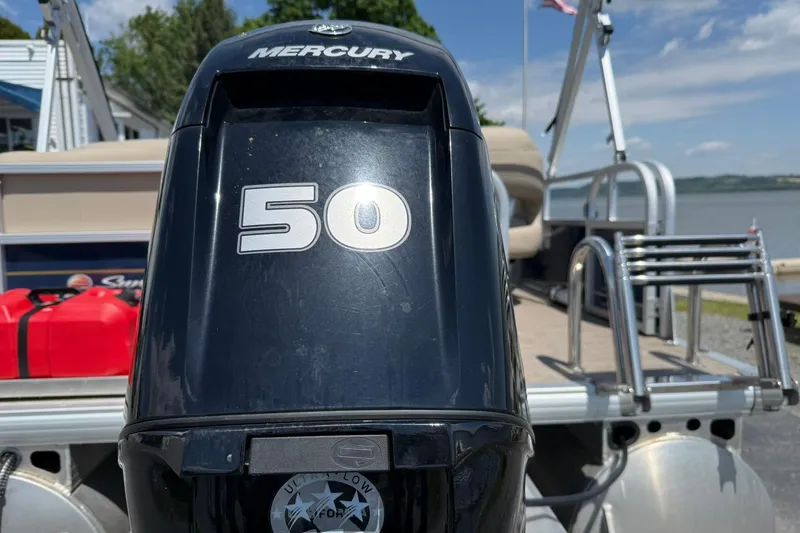 Slide: The Image of 2023 Sun Tracker Bass Buggy 16 XL Select with Mercury 50 engine by the water. - 4