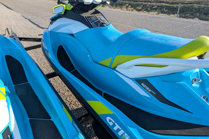 Slide: The Image of 2016 Sea-Doo GTI SE 130 jet ski in vibrant blue on a trailer. - 10