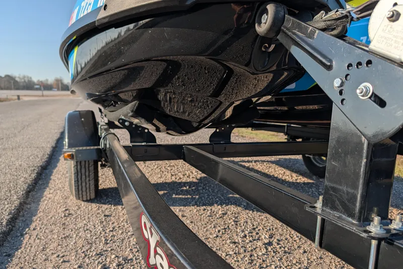 Slide: The Image of 2016 Sea-Doo GTI SE 130 on trailer, close-up view of hull and trailer structure. - 14