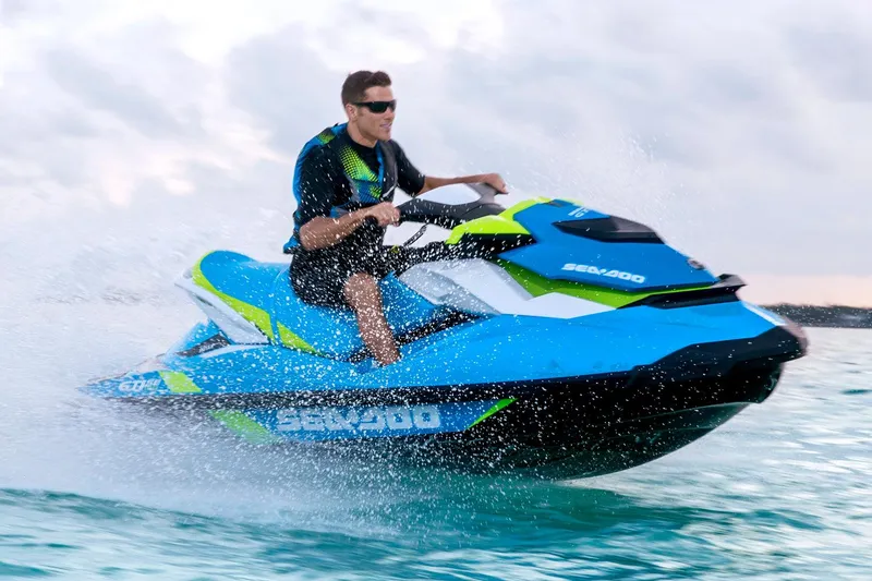 Slide: The Image of Manufacturer Provided Image: Man riding 2016 Sea-Doo GTI SE 130 jet ski on water. - 16