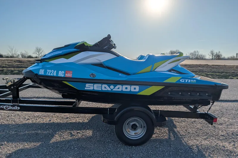 Slide: The Image of 2016 Sea-Doo GTI SE 130 jet ski on trailer, parked outdoors. - 6