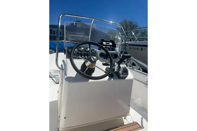 Slide: The Image of 2007 Boston Whaler 160 Dauntless boat console with steering wheel and controls. - 5