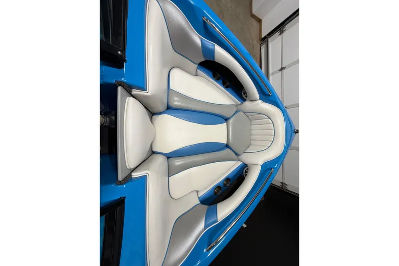Slide: The Image of 2016 Sanger V237 S boat interior with blue and white seating design. - 13