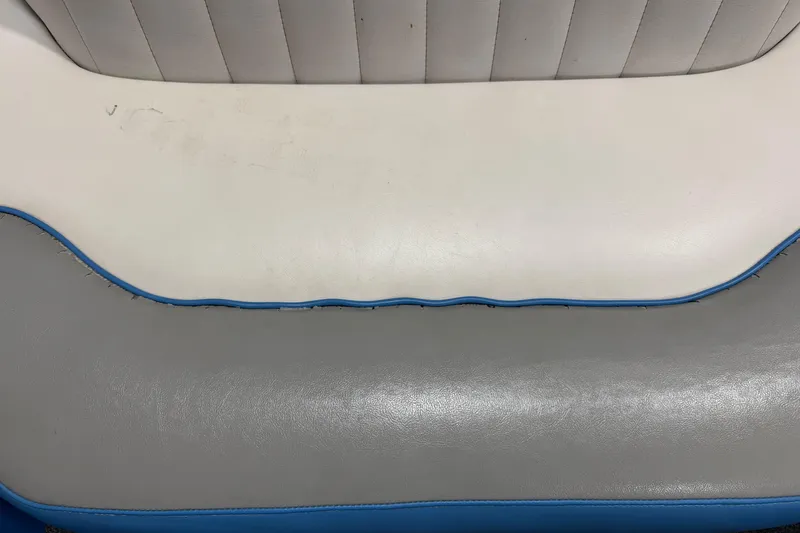Slide: The Image of 2016 Sanger V237 S boat seat with white and gray upholstery, blue trim. - 19