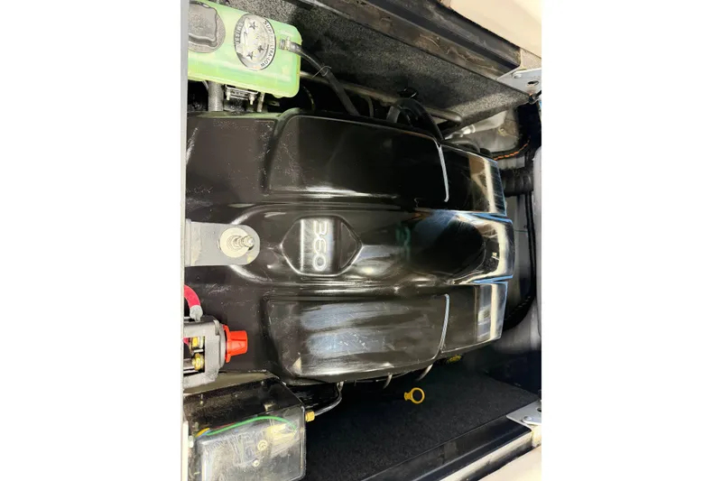 Slide: The Image of Engine compartment of a 2016 Sanger V237 S boat, featuring a 360 horsepower engine. - 25