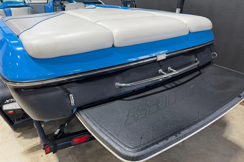 Slide: The Image of 2016 Sanger V237 S boat with blue and white upholstery, rear view. - 6