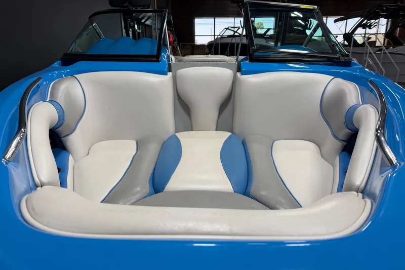 Slide: The Image of Interior of a 2016 Sanger V237 S boat with blue and white seating. - 9