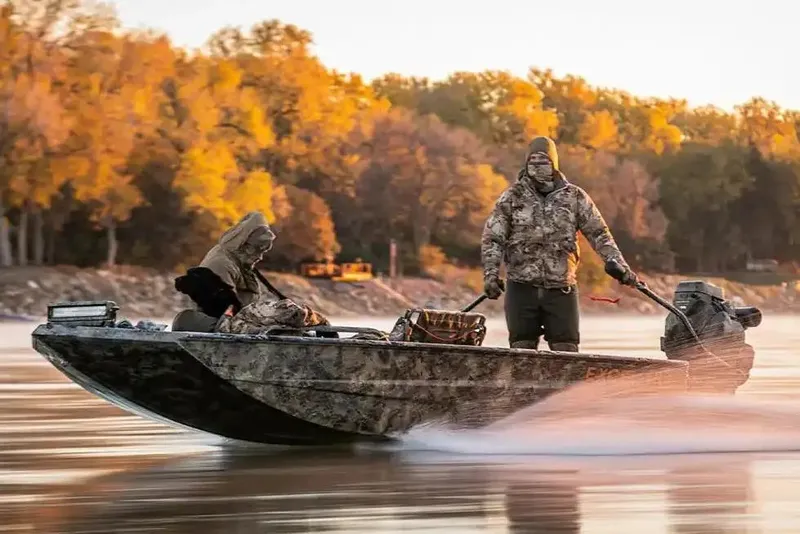 Slide: The Image of Manufacturer Provided Image: Man navigating Excel 1854 Shallow Water F4 Pro Hull boat on autumn river. - 14