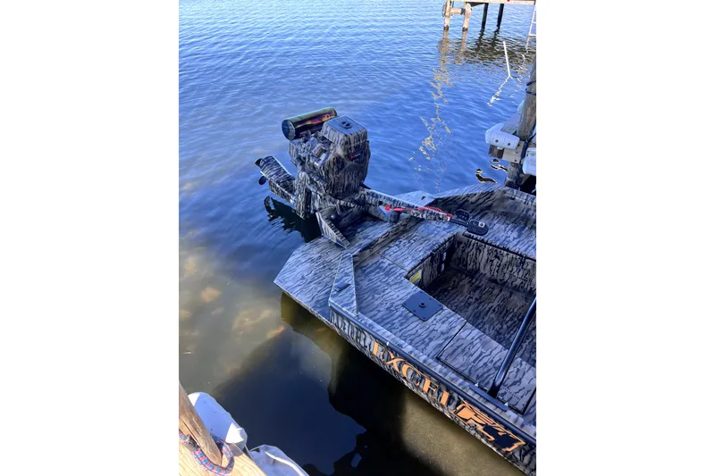 Slide: The Image of 2026 Excel 1854 Shallow Water F4 Pro Hull boat docked on calm water. - 4