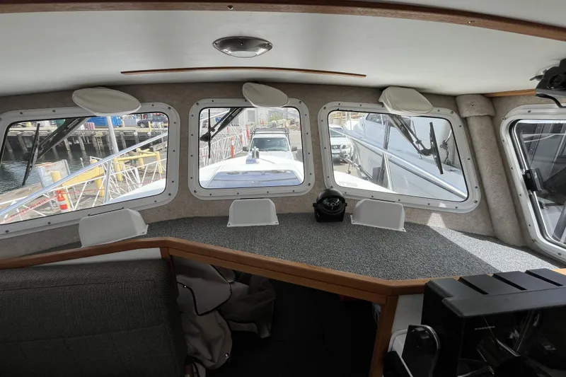 Slide: The Image of Interior view of 2022 Sea Sport 24' Explorer boat with dockside windows. - 16