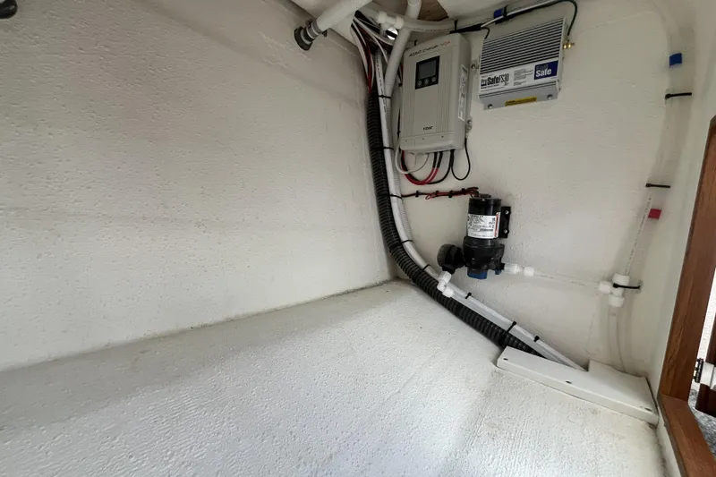 Slide: The Image of Electrical and plumbing systems inside a 2022 Sea Sport 24' Explorer boat. - 25