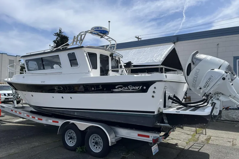 Slide: The Image of 2022 Sea Sport 24' Explorer boat on trailer with Suzuki outboard motor. - 3