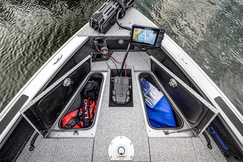 Slide: The Image of Manufacturer Provided Image: 2025 Lund 1875 Pro-V boat interior with storage compartments and navigation system. - 19