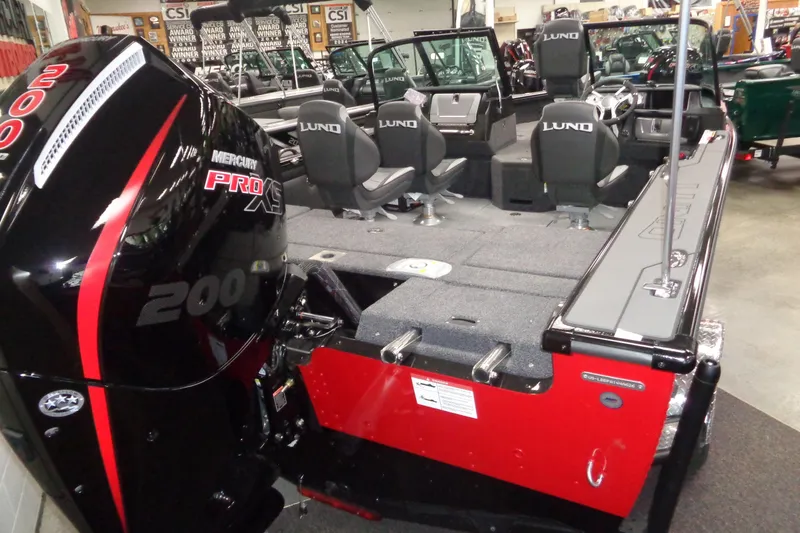 Slide: The Image of 2026 Lund 1875 Pro-V boat with Mercury Pro XS 200 engine in showroom. - 3