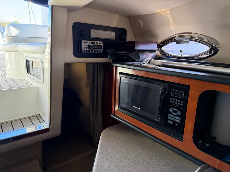 Slide: The Image of Interior of a 2006 Sea Ray Sundancer 260 with microwave and stereo system. - 13