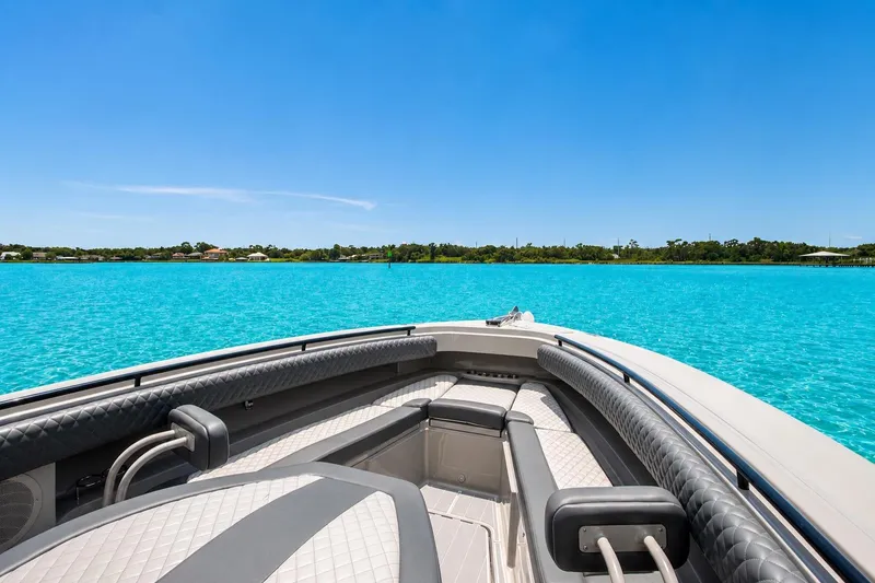 Slide: The Image of 2022 HCB 42 Lujo boat on clear turquoise water under blue sky. - 3