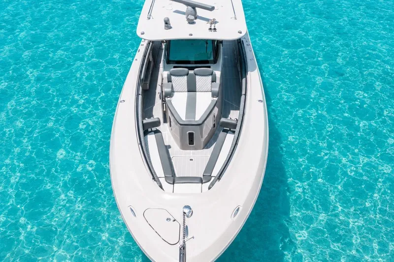 Slide: The Image of 2022 HCB 42 Lujo boat on clear turquoise water, aerial view. - 5